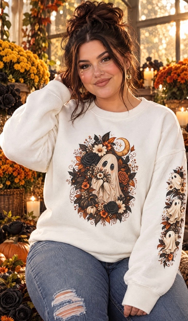 Model wearing the Autumn Ghost Garden crewneck with floral ghost artwork and matching sleeve print.