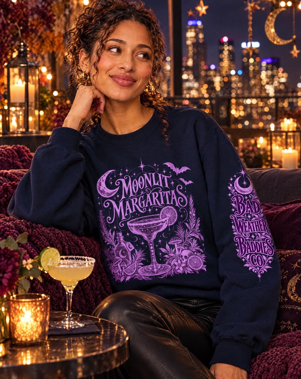 Model wearing the Moonlit Margaritas witchy crewneck at a candlelit rooftop lounge.