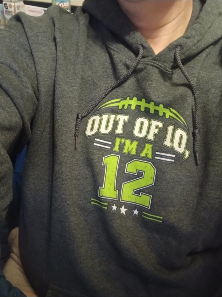 Stacey wearing her dark heather gray Out of 10 I'm a 12 Game Day Hoodie