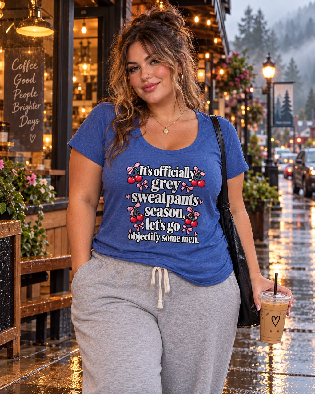 Grey Sweatpants Season scoop neck tee styled outside a rainy coffee shop