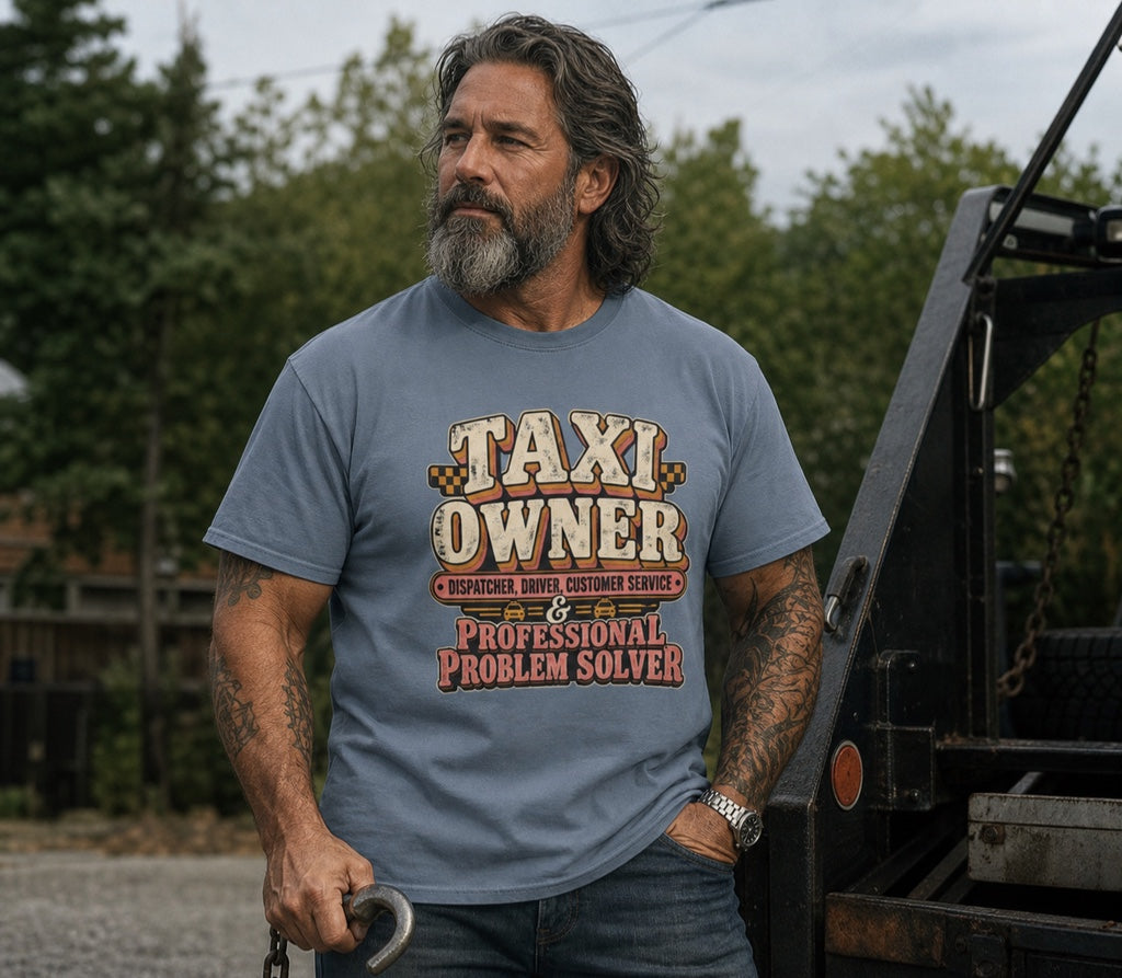 Taxi owner wearing Taxi Owner Professional Problem Solver shirt beside a tow truck